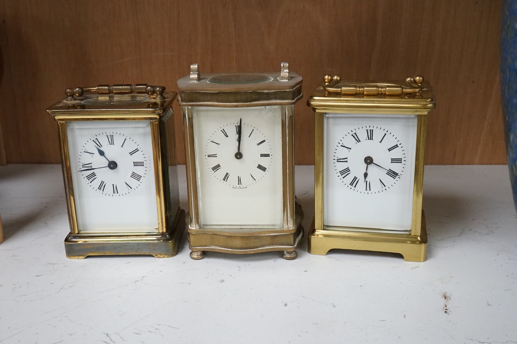 Three brass cased carriage timepieces, largest 16cm high
